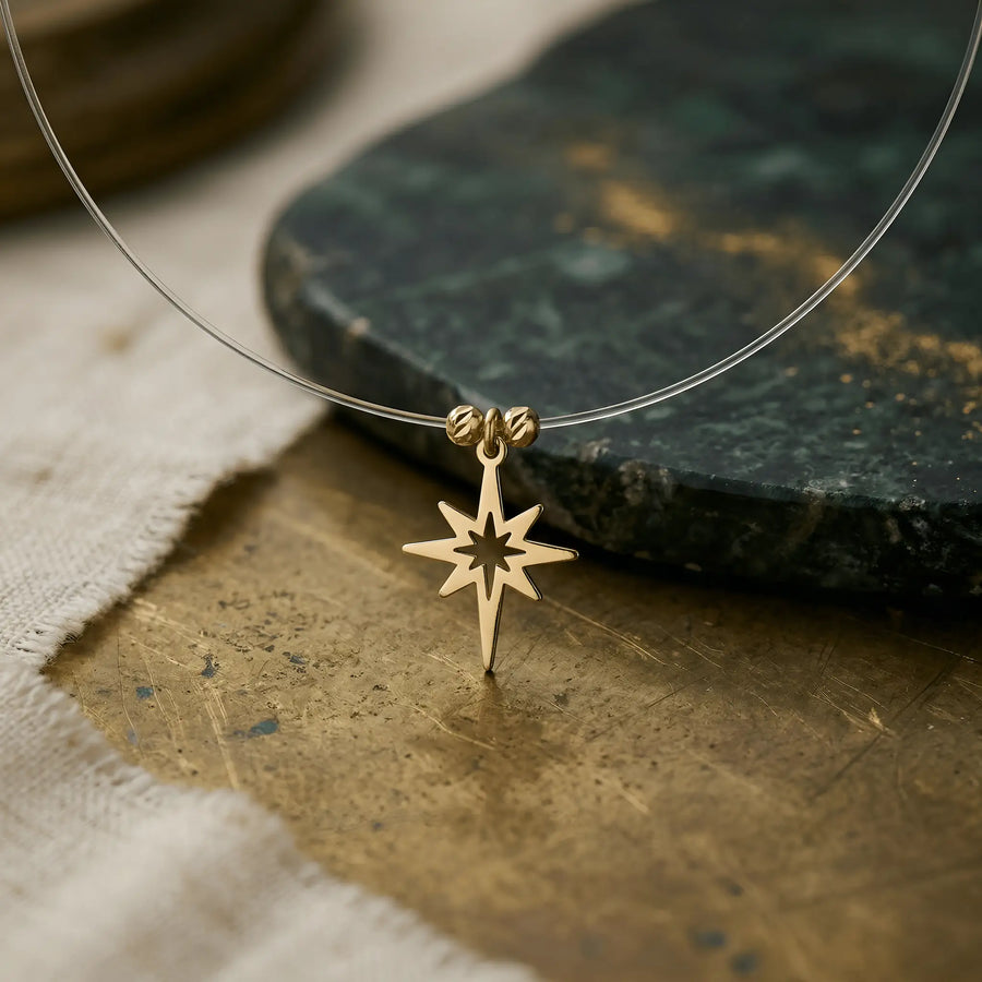 Colier aur 14K cu Steaua Nordului compass rose 8 vârfuri pe fir transparent — floating
