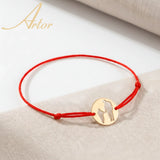 Brățară aur 14K cu șnur roșu și pandantiv bănuț tată și copil 14×14 mm