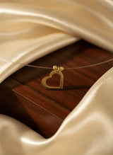 Colier Aur 14K Inimă pe Fir Transparent – Model Floating
