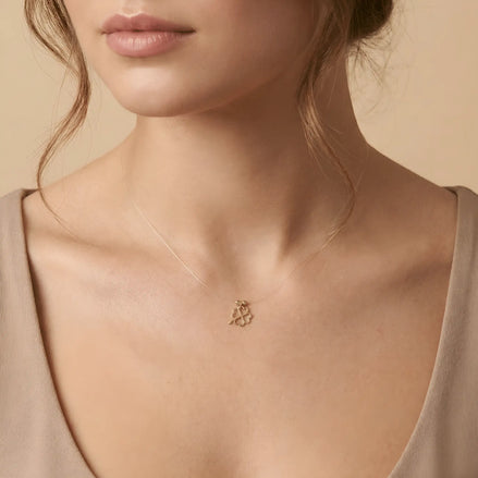 Colier Aur 14K cu Trifoi cu Patru Foi pe Fir Transparent – Model Floating