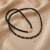 Colier choker aur 14k cu cristale negre fațetate, bile de aur și pandantiv fluture decupat, lucrat manual