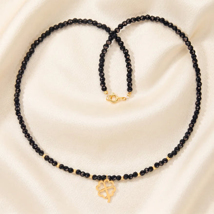 Colier choker aur 14k cu cristale negre fațetate, bile de aur și pandantiv trifoi cu patru foi, lucrat manual